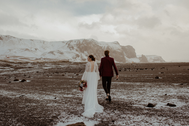 A person and person walking in a snowy area in Iceland, organised by Best Day Ever Events